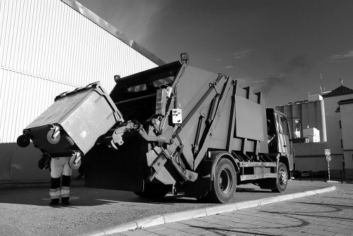 Waste removal truck servicing a commercial building